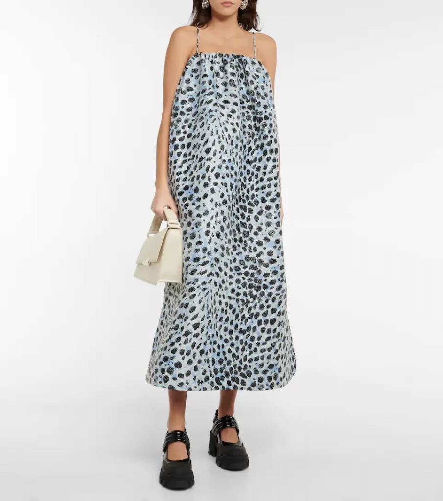 Blue toned animal-print midi dress in jacquard design with minimalist spaghetti straps and an exaggerated shift shape. Partially recycled fabric ensures planet-friendly wear.