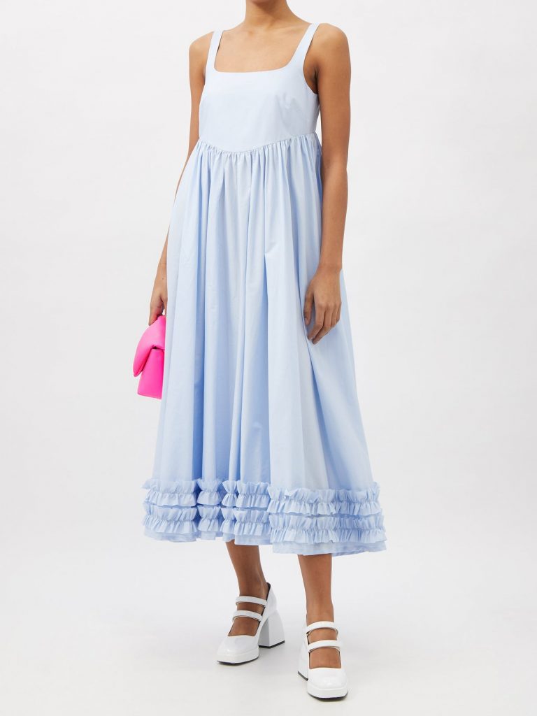 Made in England from lightweight cotton poplin, this light blue Ellen dress evokes a retro mood with the gently ruffled hem and scooped back cut.