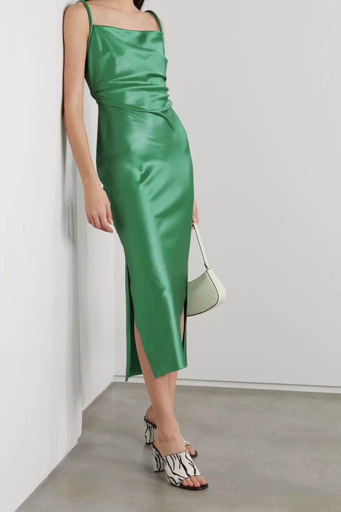 Nanushka's 'Irma' midi dress channels the effortless yet alluring charm of '90s slip styles. It's made from lustrous green satin that's cut on the bias, so it falls beautifully over your frame and has an open back framed by distinctive tubular straps.