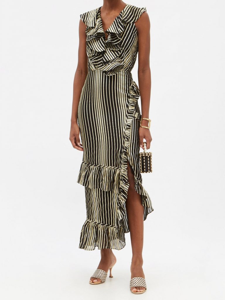 Saloni's black Anita dress is made with shimmering gold stripes and accented with billowing ruffles that pull focus to the V-neck and fitted midi-length skirt.