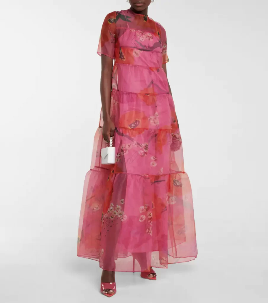 Staud pink floral sheer maxi dress made from tiered and printed sheer organza, it has an opaque underdress and buttoned back.

