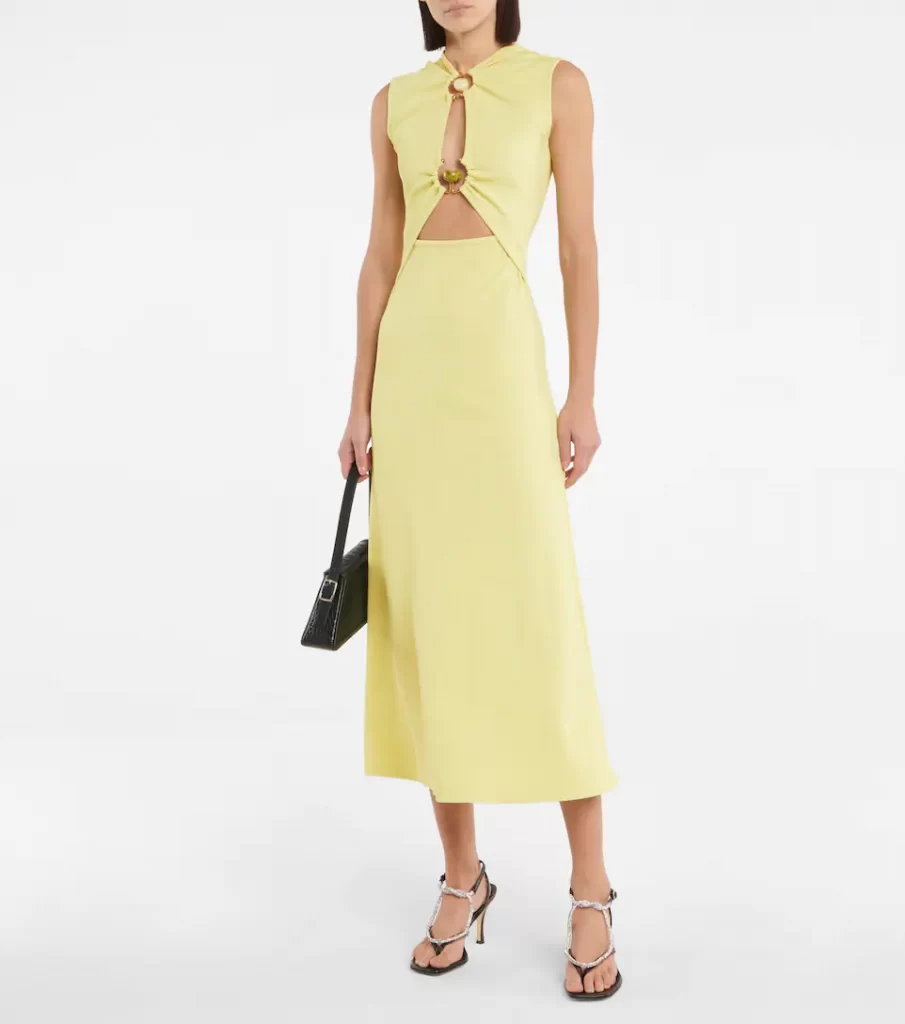 This yellow midi dress with daring cutout details from Christopher Esber is an exciting addition to your dress collection. It's made from ribbed jersey into a fitted silhouette with brass and natural stone embellishments holding the cut out details at the neck and under the bust. 