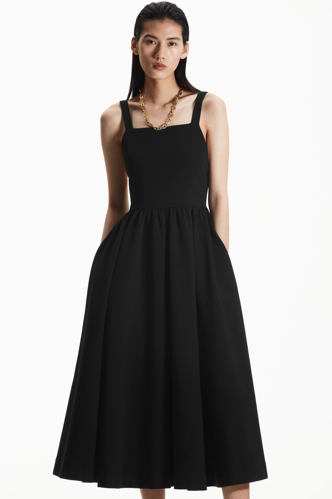 Crafted from a comfortable cotton-blend, this elegant mid-length dress features a square neck, deep open back and full gathered skirt. The front darts, concealed zip-fastening  and pockets add the finishing touches to this statement look.