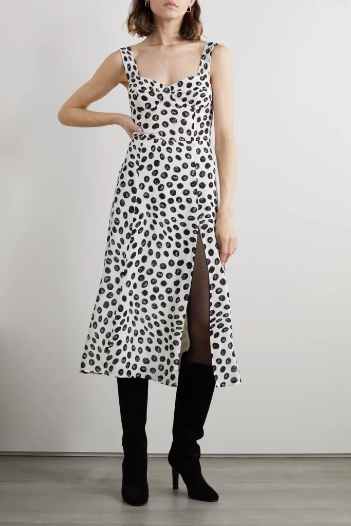 Reformation's white and black polka-dot midi dress in crepe de chine has a sweetheart neckline and daring split that shows off a flash of leg.
