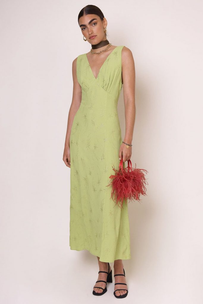 Bias cut ankle length chartreuse dress with v neck and thick straps gathering at the bust. Close fit with looser flowy hem. Embellished with tonal beads in shooting star patterns. 