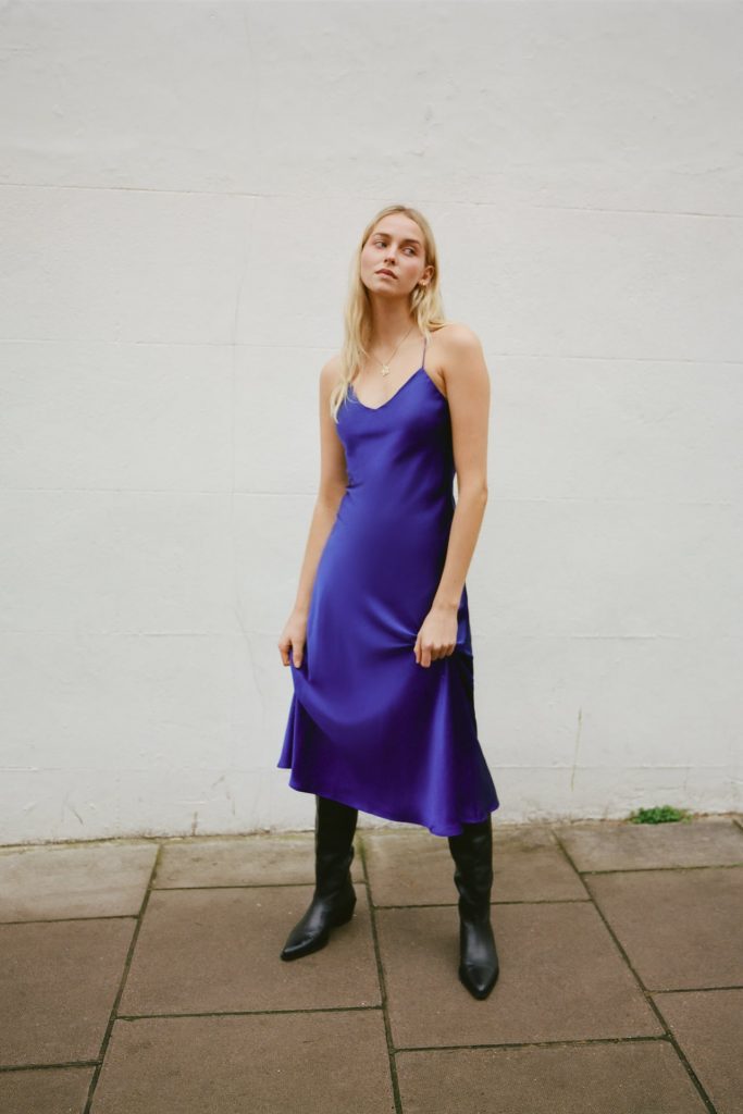 Mid cobalt-blue satin midi dress with a V-neckline and thin crossed back halter straps. Invisible back zip fastening.