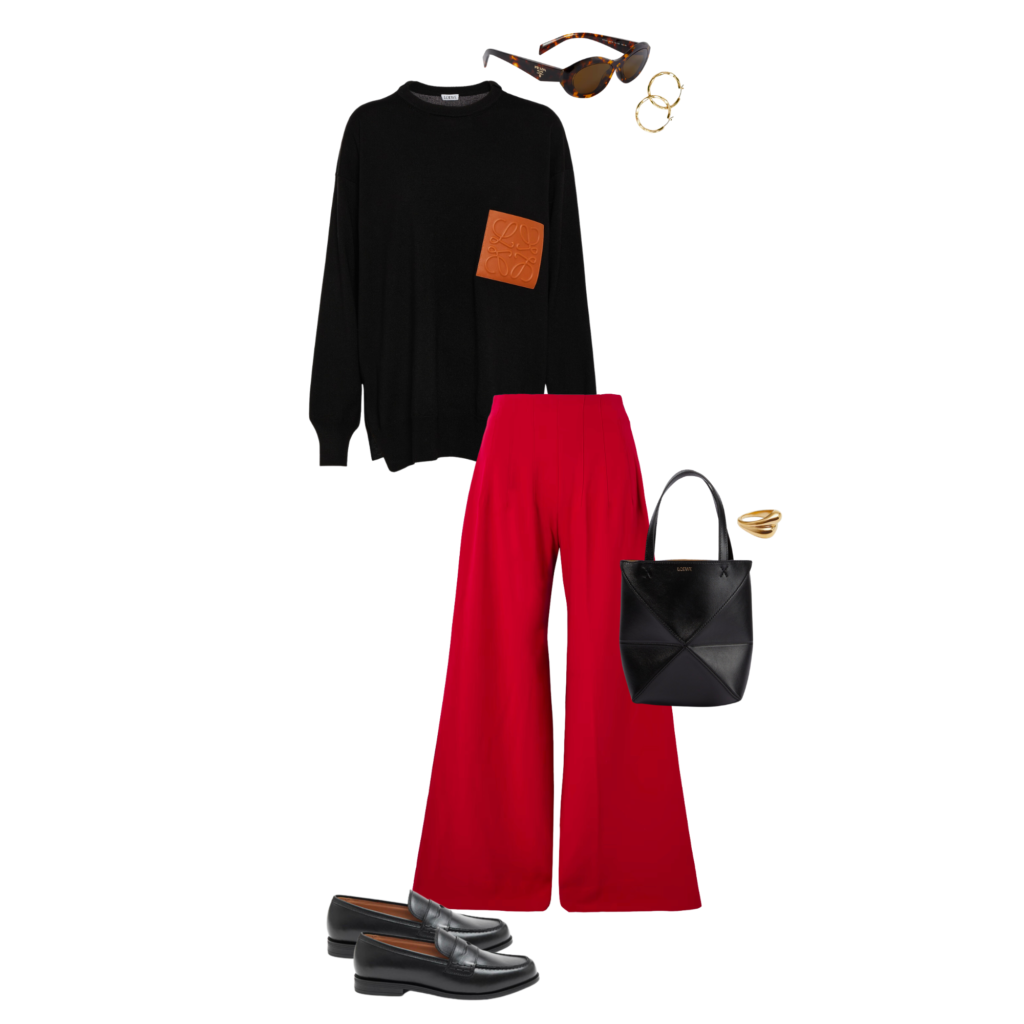 Image depicting how to wear red in 2023. Black Loewe knit, red wool wide-leg trousers, black bag, gold ring, gold earrings, tortoiseshell sunglasses, black loafers. 