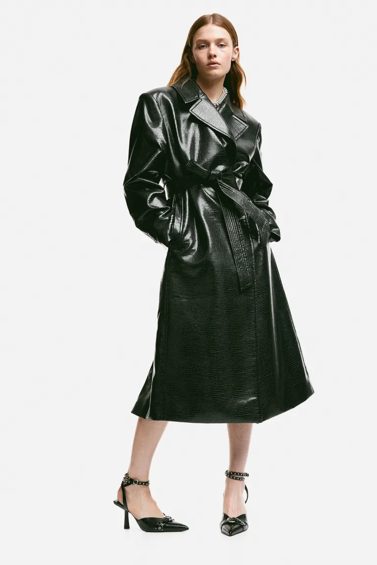 H&M Calf-length, double-breasted trenchcoat in coated fabric with a crocodile pattern. Wide notch lapels, concealed press-studs at the front and a detachable tie belt at the waist. Shoulder pads, long sleeves, welt side pockets and a slit at each side of the hem. Lined.
