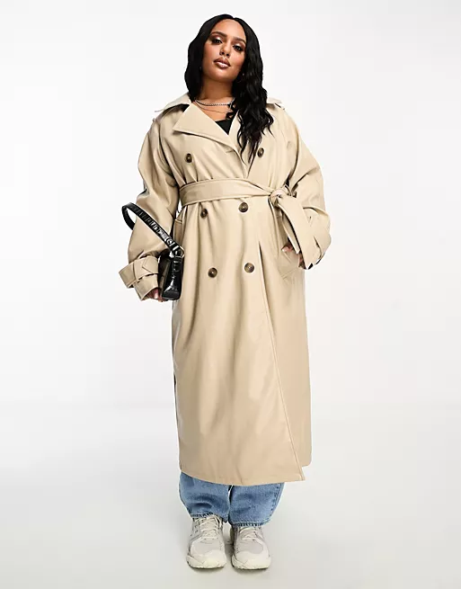 ASOS design curve faux leather stone trench coat with double-breasted button fastening, self-tie belted waist, and classic trench coat styling. 