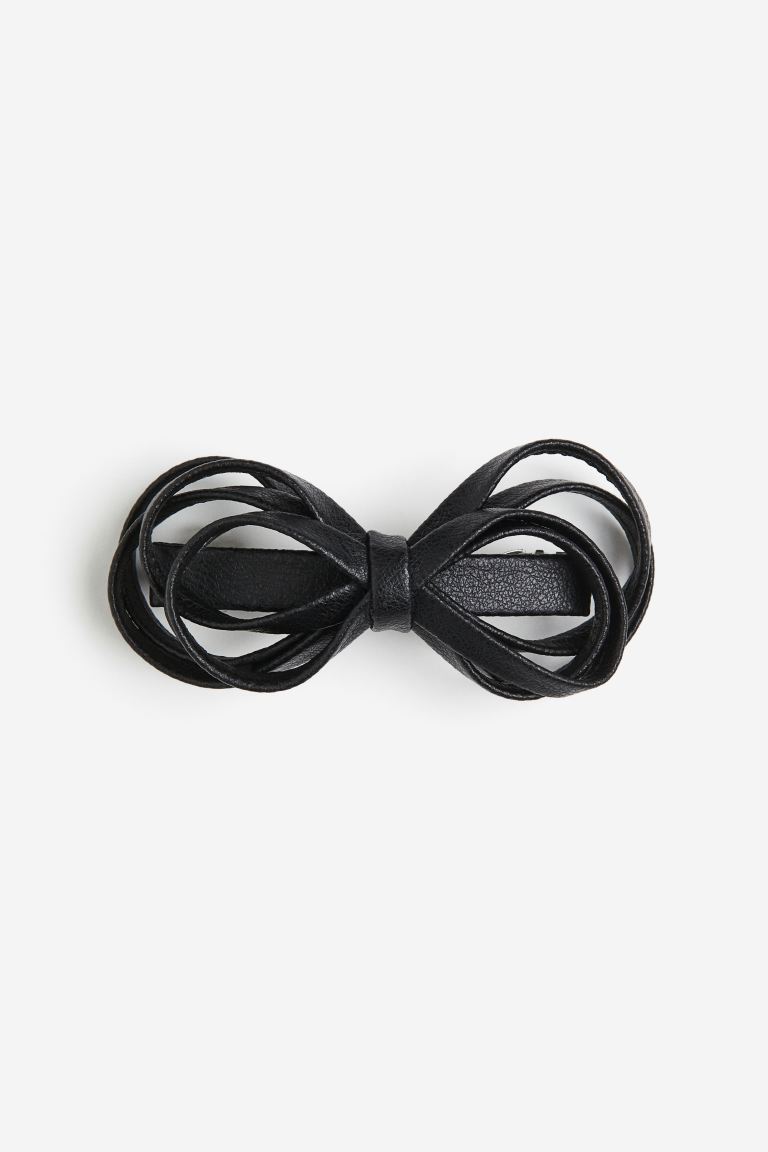 H&M black Metal hair clip decorated with a bow of multiple straps.


