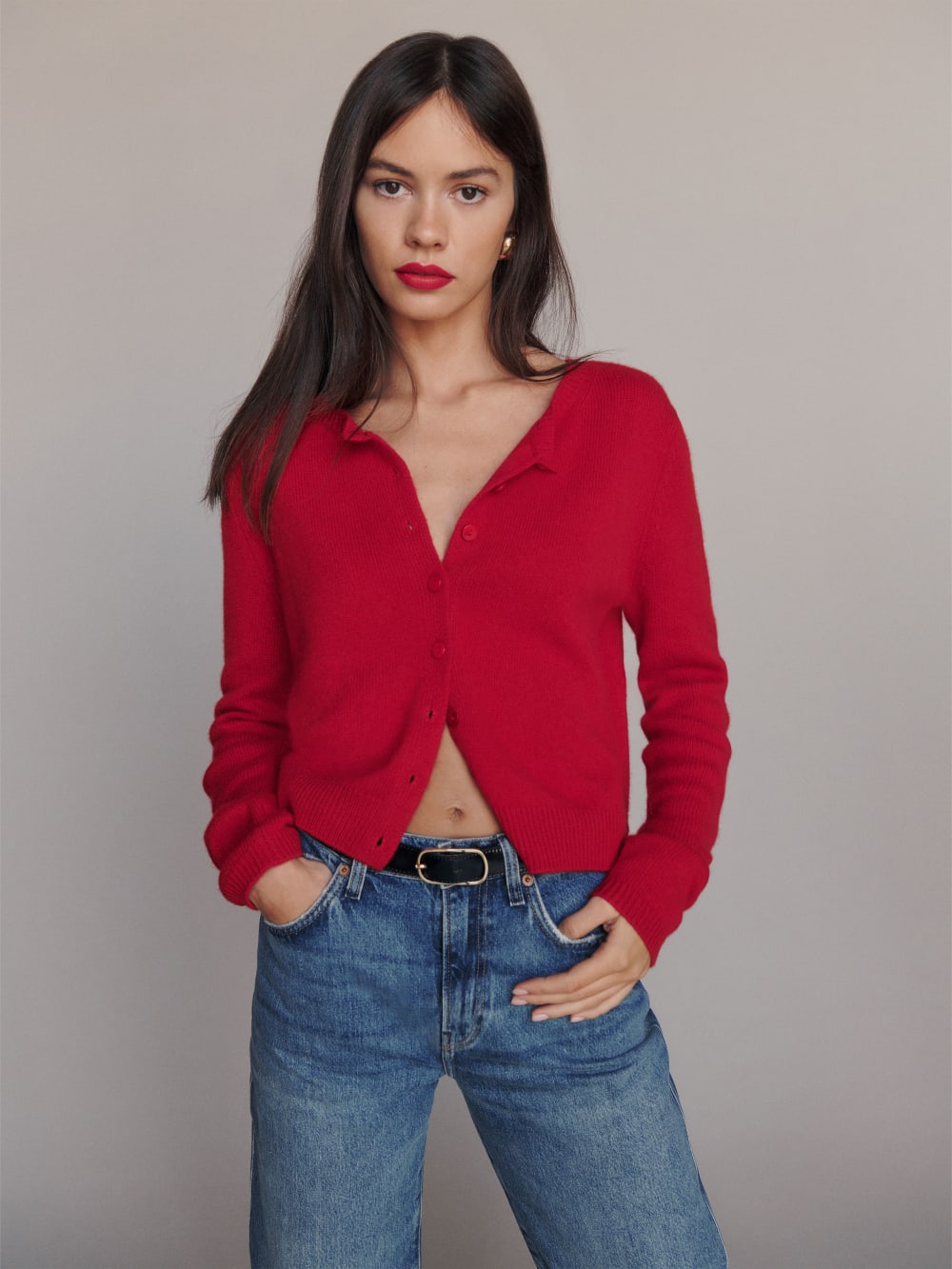 Reformation red cardigan with Button front, and ribbed hem.