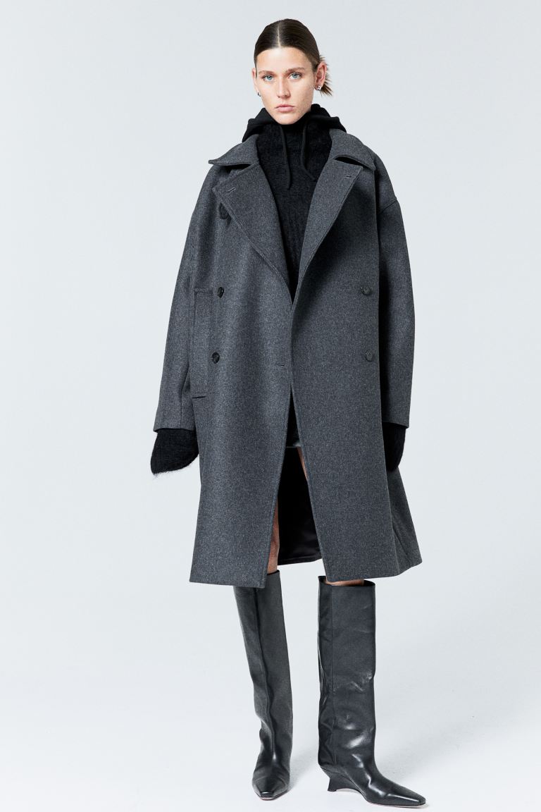Trending Winter Coats 2023 2024 - H&M Premium Selection New Arrival
grey Knee-length, double-breasted coat in soft, woven fabric made from a wool blend featuring a stand-up collar with a tab and buttons, wrapover front with buttons, dropped shoulders and welt side pockets. Lined.

