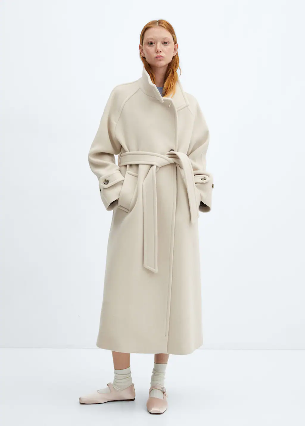 Mango cream coat. Premium quality. Virgin wool blend fabric. Long design. Straight design. Turtleneck. Long sleeve with buttoned cuffs. Two side pockets. Front button closure. Ribbon on the waist with tie closure. Back-slit hem. Loops. Inner lining.