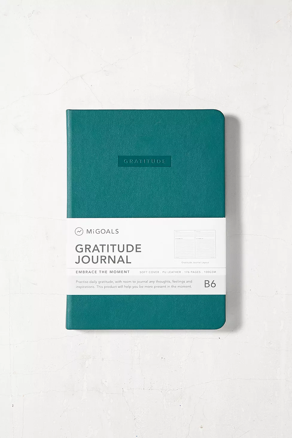Chic Secret Santa Gift Ideas for every budget in 2023. Start feeling more grateful with this daily journal by MiGoals. The embossed PU journal includes FSC Certified paper inside with gratitude exercises and worksheets to bring better wellness into your day-to-day.