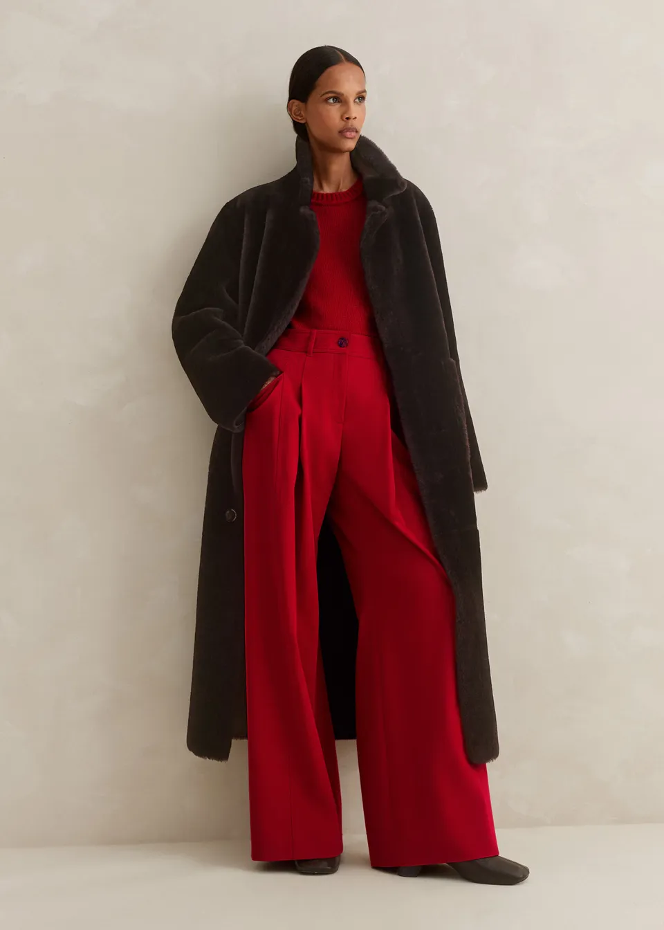 Me + Em brown reversible shearling longline coat with a cocoon-like silhouette, this reversible longline coat is a versatile investment and the perfect antidote to autumn temperatures.