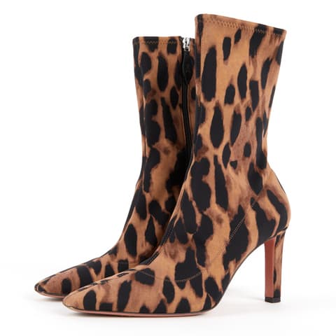 Pre loved Beige and black leopard allover print stretch fabric zip-up ankle boots. Covered heel. Pointy toe. Dark pink leather insole. Made in Italy. Size 38.5. Heel 9cm. Details: friction marks on outsoles. A few slight tiny signs of wear in other places.