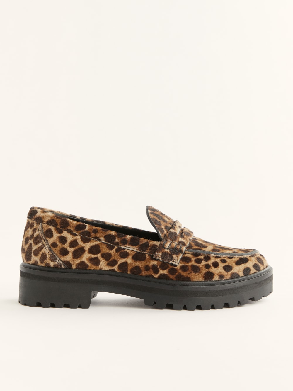 Reformation Agathea chunky leopard print loafer with Lug sole heel, round toe, low heel height.