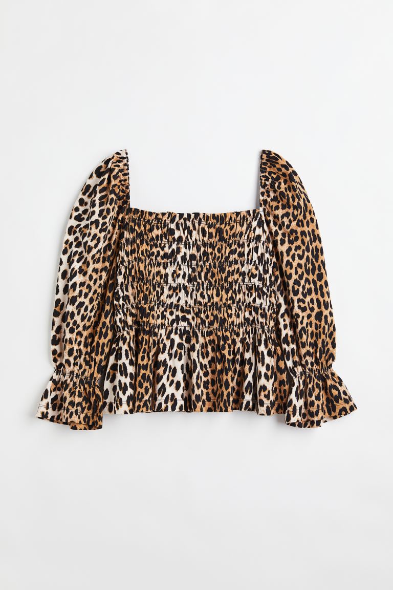 H&M leopard print top in cotton jersey with a smocked bodice and peplum. Square neckline with a small frill trim and narrow, covered elastication around the shoulders, and long puff sleeves with narrow, covered elastication and a flounce.