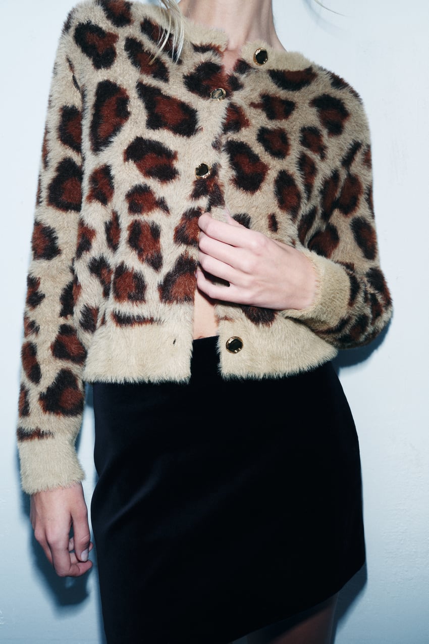 Zara leopard print Cardigan with a round neck and long sleeves. Faux fur fabric and animal jacquard detail. Front golden button fastening.