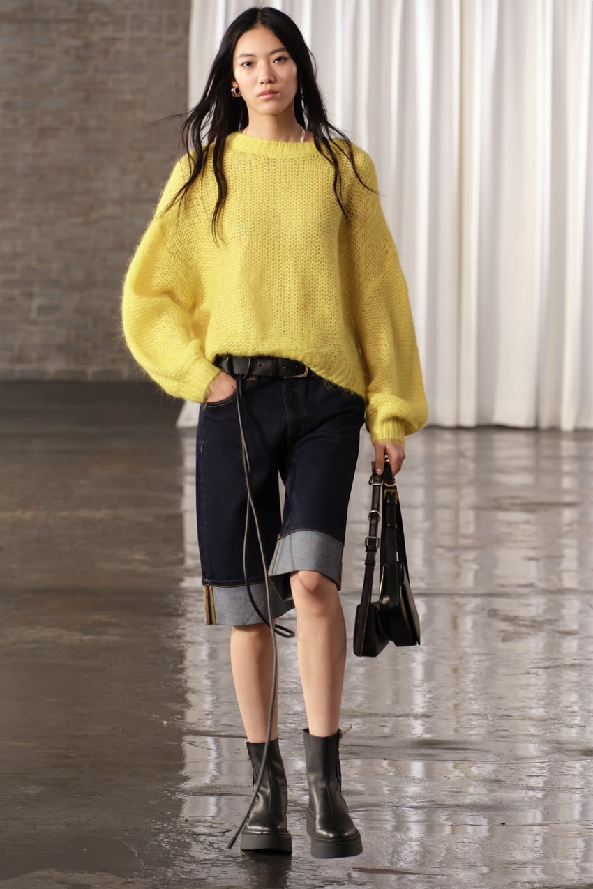 jorts trend 2024 - ZARA WOMAN COLLECTION High-waist denim Bermuda shorts with belt loops and a five-pocket design. Contrast visible topstitching detail. Turn-up hems. Front zip fly and top button fastening.