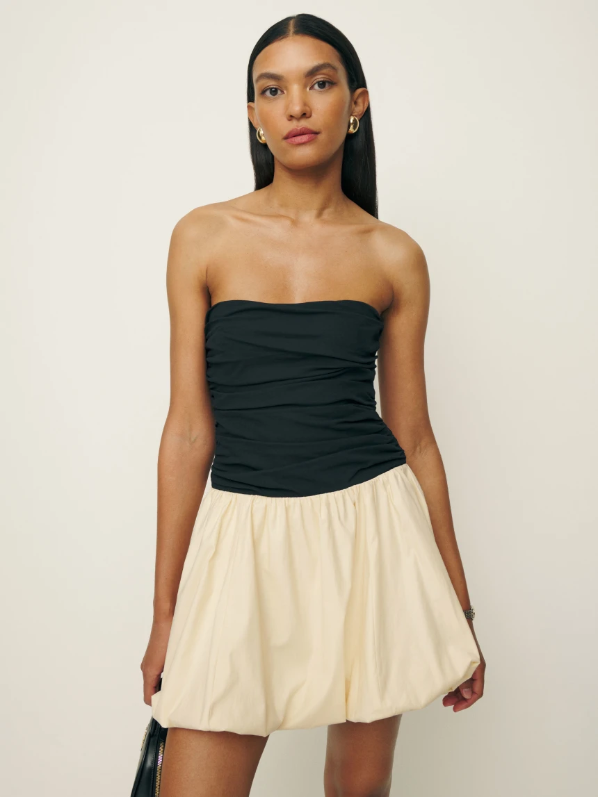 Reformation bandeau bubble hem Clea Dress with black bandeau top and cream skirt. 
