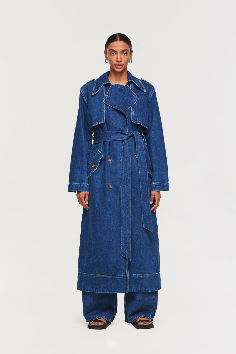 Aligne classic trench coat, but make it denim. Jamison is ALIGNE’s re-imagination of a versatile staple that every wardrobe needs. Designed to be long, it has a flattering silhouette with beautiful details such as horn buttons and contrast top-stitching. The perfect layering piece, this easy-to-wear trench coat is guaranteed to steal some attention.